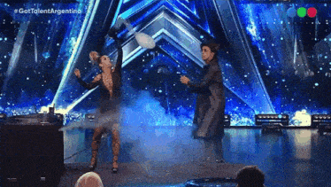 a man and a woman are performing on a stage with the words gottalent argentina on the bottom