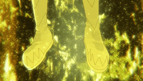 a person wearing a pair of yellow boots with the letter w on them