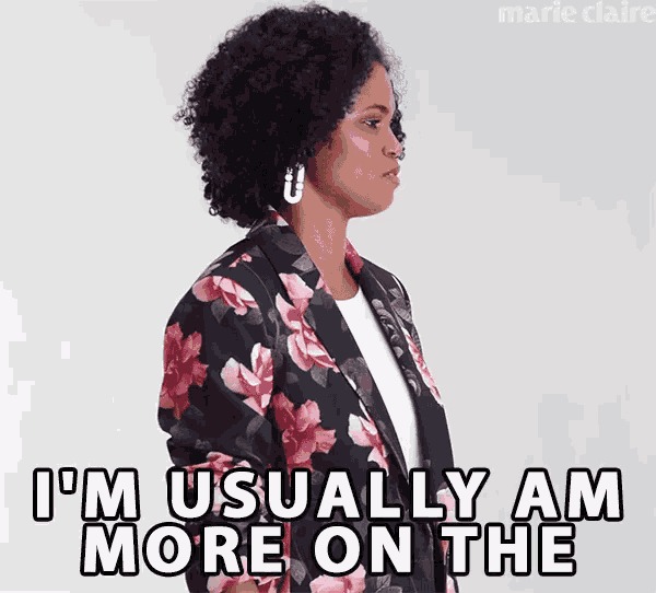 a woman is wearing a floral jacket and says i 'm usually am more on the