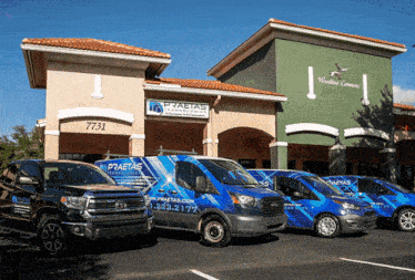a row of vans parked in front of a building that says praetas