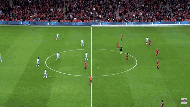 a soccer field with advertisements for sunny 4k led tv denizbank and kia