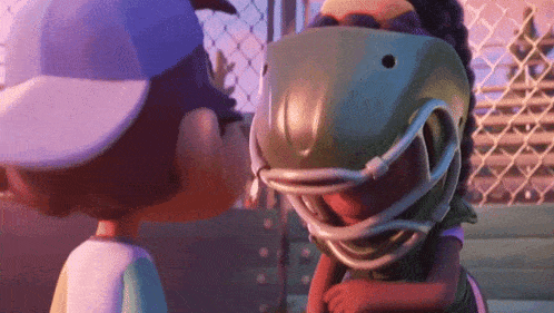 a boy and a girl are looking at each other and the girl is wearing a football helmet .