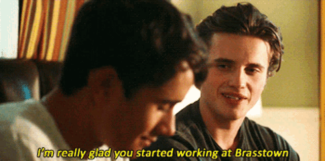 a man says i 'm really glad you started working at brasstown while another man looks on