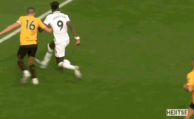 a blurry picture of a soccer goal with the word heitse on the bottom