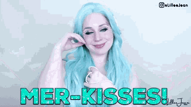 a woman with blue hair has the words mer-kisses on her face