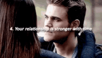 a man and a woman are hugging and looking at each other with the words `` your relationship is stronger with time '' .