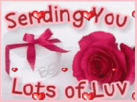 a sending you lots of luv card with roses and a gift box