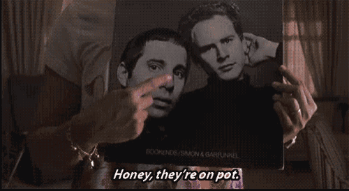 a person pointing at a picture of two men with the words honey they 're on pot