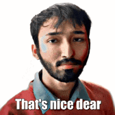 a man with a beard is wearing a red sweater and a blue shirt and says that 's nice dear .