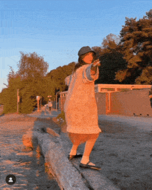 a person standing on a log with a person 's face on the bottom right