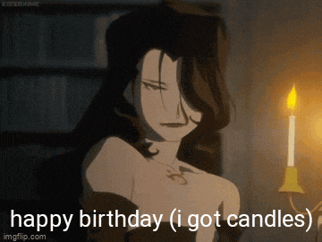 a woman is holding a lit candle and says happy birthday