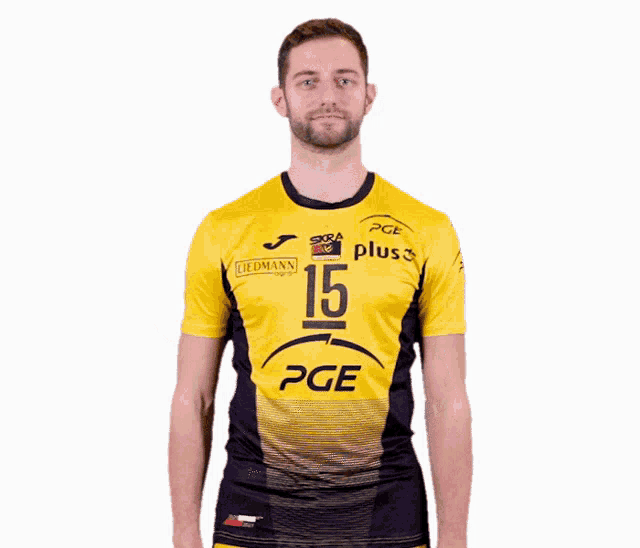 a man is wearing a yellow and black pge jersey