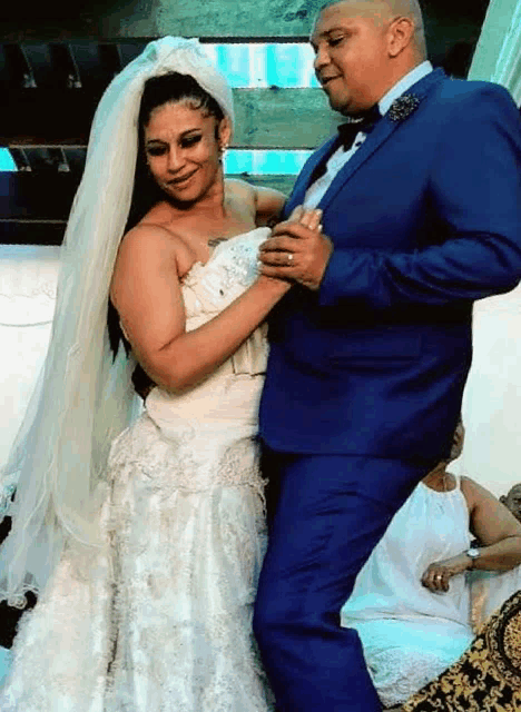a bride and groom are dancing together at their wedding