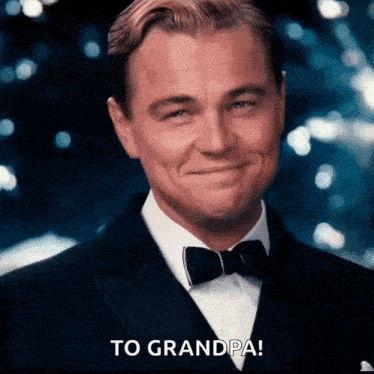 a man in a tuxedo and bow tie is smiling and says to grandpa