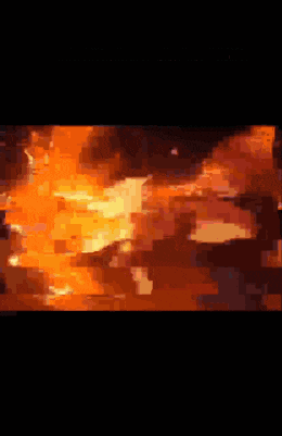 a person is laying on the ground with a fire coming out of their mouth