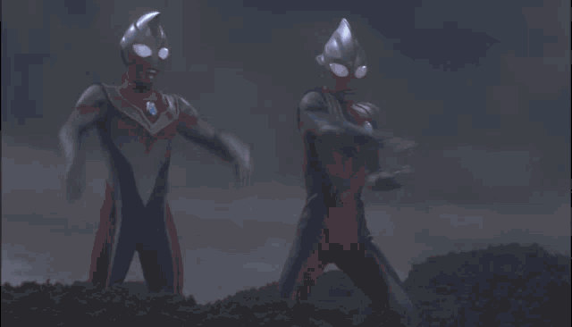 a monster with red eyes is standing in the dark with a blue light behind it .