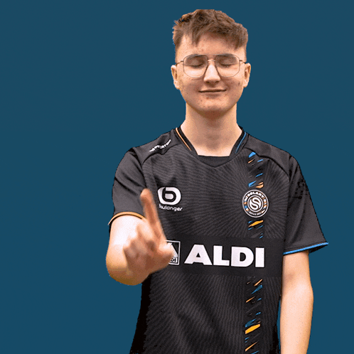 a man wearing a black shirt that says aldi on the front