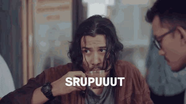 a man drinking from a cup with the word srupuut written on it