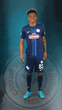 a soccer player wearing a blue shirt with a çaykur logo on it