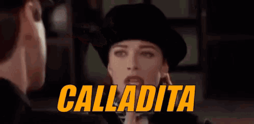 a man in a police hat is standing in front of a sign that says calladita .