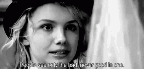 a black and white photo of a young girl with the words " people see only the bad never good in one "