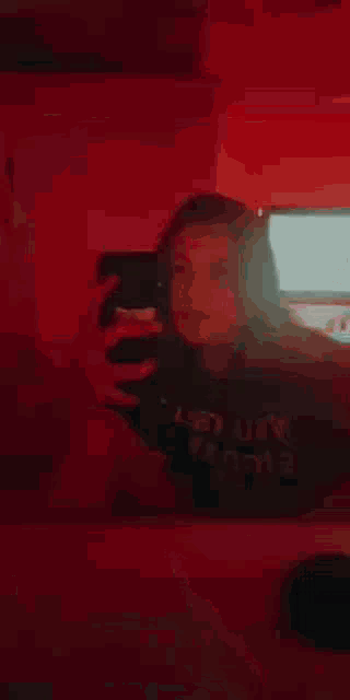 a blurred image of a red and white object on a dark background