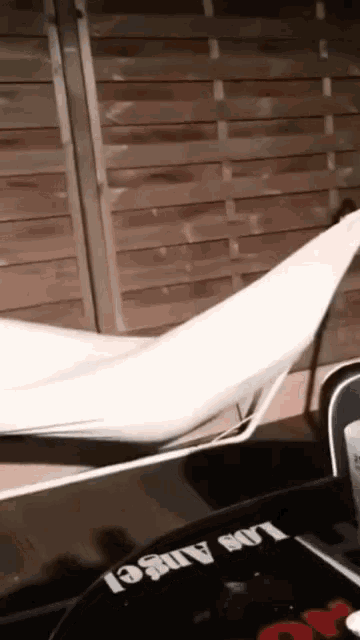 a white item is laying on a table with the word los angeles on it
