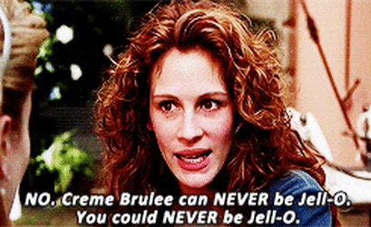 a woman with red hair is talking to another woman and says creme brulee can never be jello .