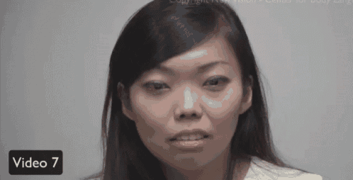 a woman 's face is shown in a video with the number 7 next to it