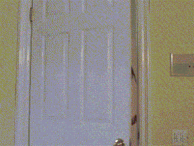 a woman in a pink shirt is standing in a doorway with her hand on her chest and the words `` oh my god '' .
