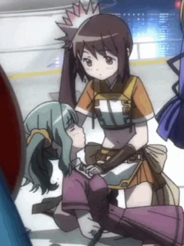 a girl in a purple skirt kisses another girl on the cheek