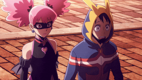 a boy and a girl are standing next to each other on a sidewalk