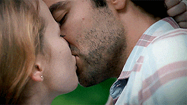 a man and a woman are kissing each other