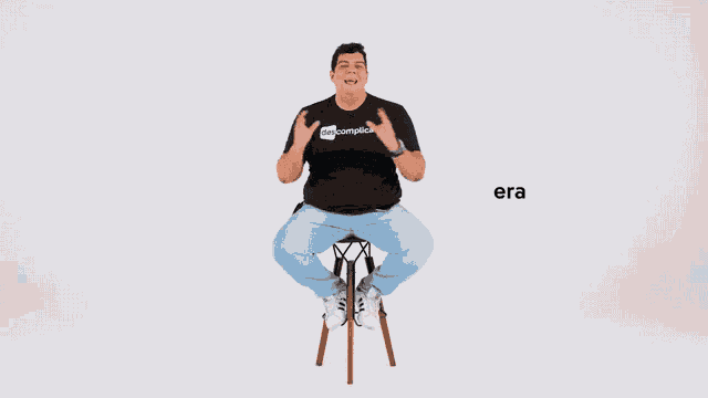 a man in a black shirt sits on a stool with the words trump nos eua behind him