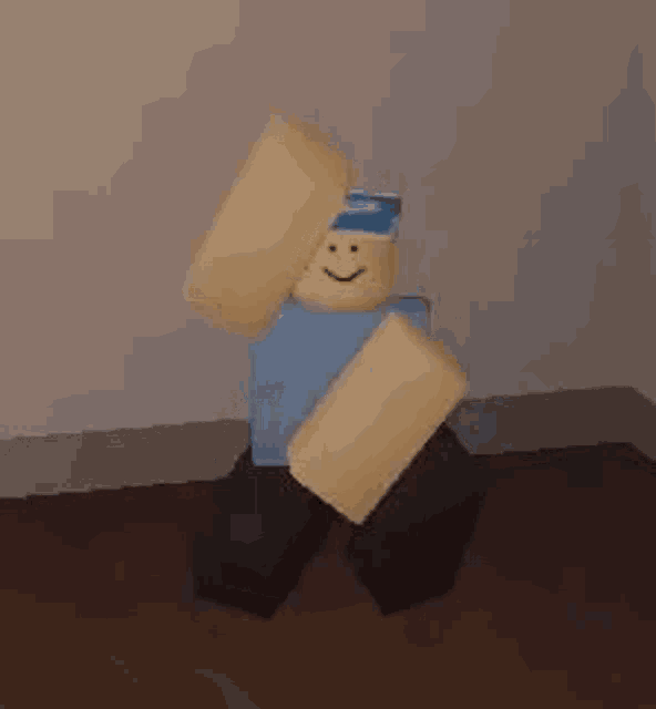 a roblox character is dancing in a room while wearing a blue shirt and a blue hat .
