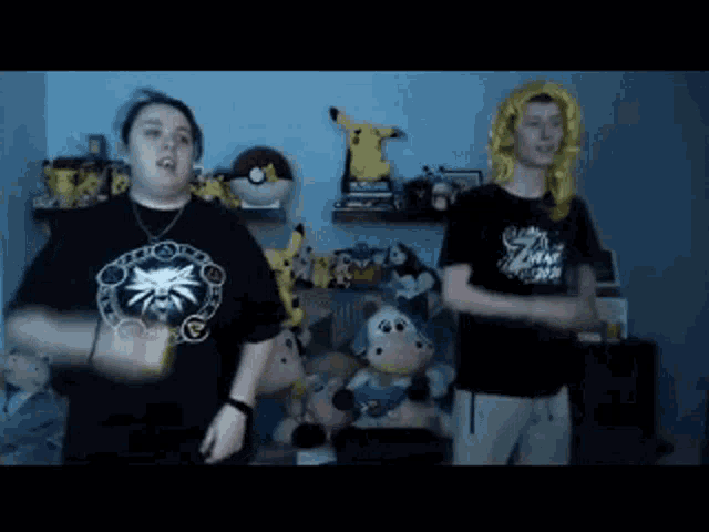 a man and a woman are dancing in a room with stuffed animals
