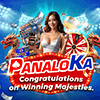 a woman is holding a wheel of fortune in front of a sign that says congratulations on winning majesties .