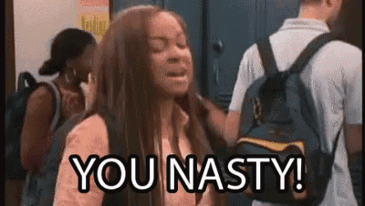 a woman with a backpack is standing in a locker room with a group of people and says `` you nasty '' .