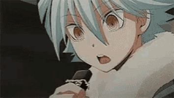 a close up of a person 's face with a surprised expression on their face .