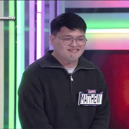 a man with a name tag that says matthew on it