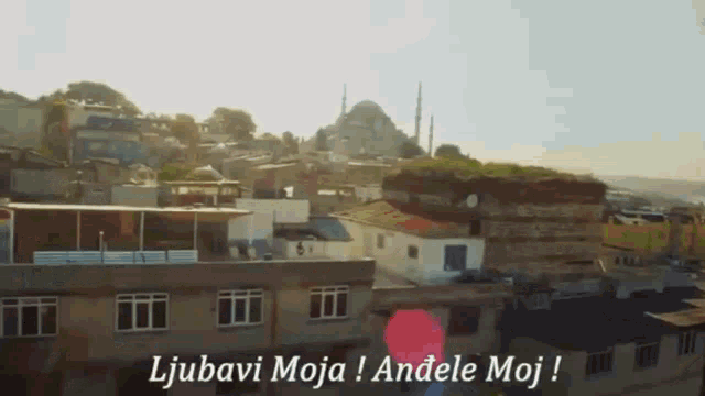 a cityscape with the words ljubavi moja andele moj