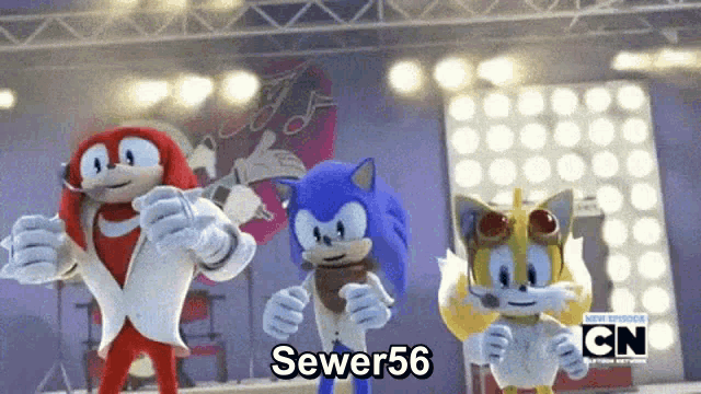 sonic the hedgehog , knuckles and tails are dancing together on a stage .