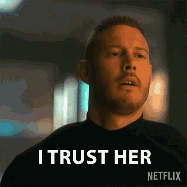 a man with a beard is saying i trust her