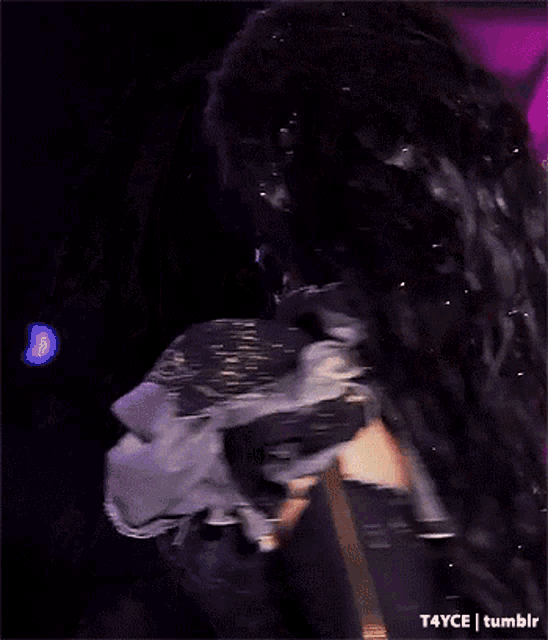 a woman is wearing a mask with blood coming out of it 's face