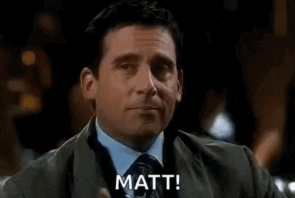 a man in a suit and tie is holding a drink in his hand and saying matt .
