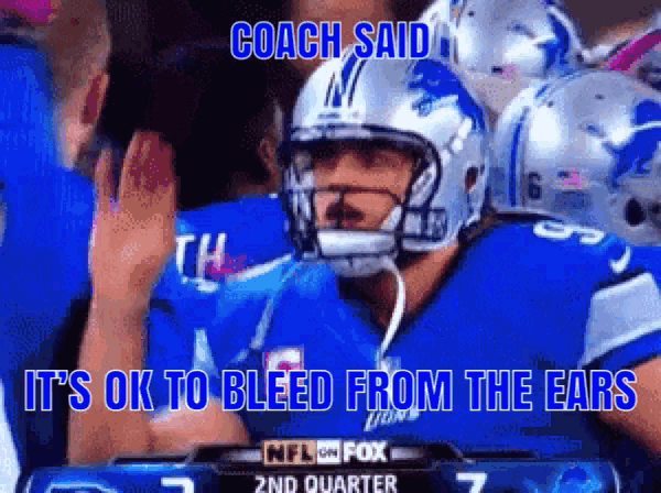 a football player wearing a helmet with the word coach on it