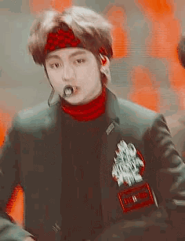 a close up of a person wearing a headband