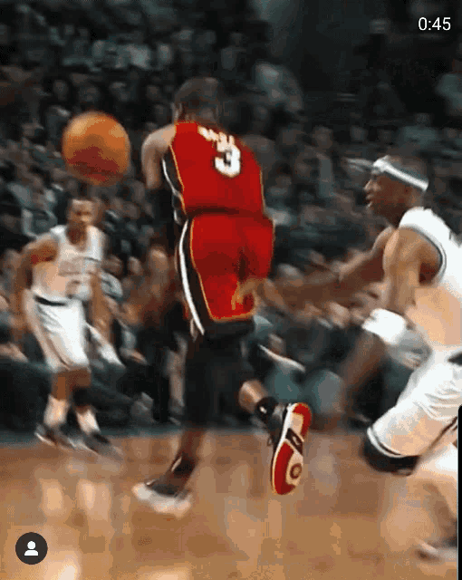 a basketball player in a red jersey with the number 3 on it