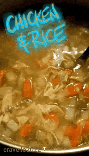 a pot of chicken and rice soup with a spoon