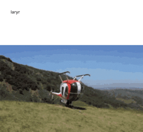 a red and white helicopter is sitting on top of a grassy hill with the word laryr below it